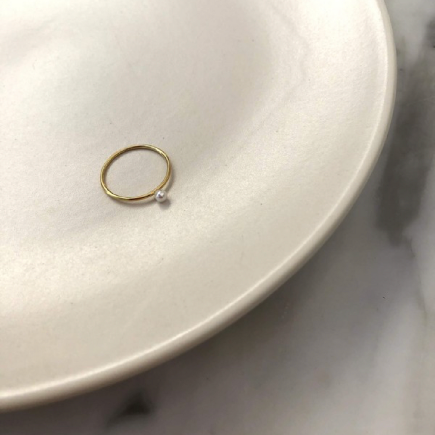 A TINY PEARL RING